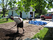 A Volunteer Spreading Mulch