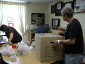People Packing Boxes for Deployed Troops